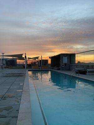 Rooftop pool area at sunset.