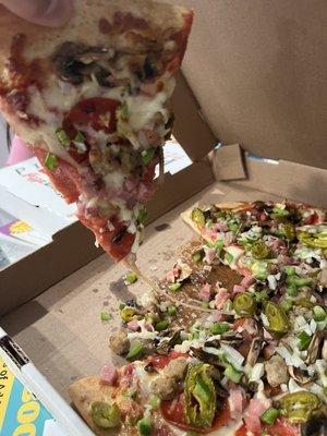 Toppings falling off as soon as you pick up a slice and soggy crust. Look at the wetness