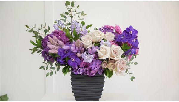 Purple combination in black vase