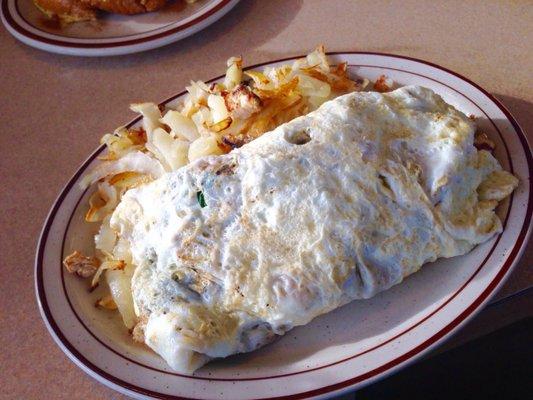 Healthy omelet: egg whites, grilled chicken, onions, and spinach with a side of hash browns