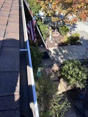 After: Cleaned gutters are now clear, lightweight, and ready for any weather. Roof cleaning done right!