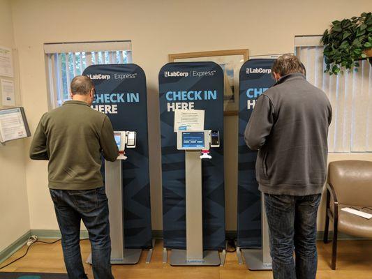 Check in kiosks replacing paper. Faster if you have an appointment.