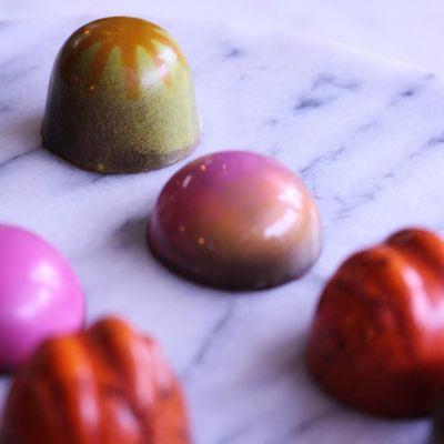 Brightly colored bonbons made in-house from bean to bar to bonbon