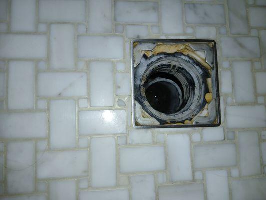 Shower drain from the top showing loose pipe