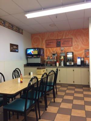 South corner of grocery corner - a dining nook with self serve pop, cappuccino, K-cup machine, tea, microwave, etc