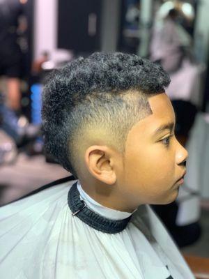 Kid haircut. Burst fade/Mohawk