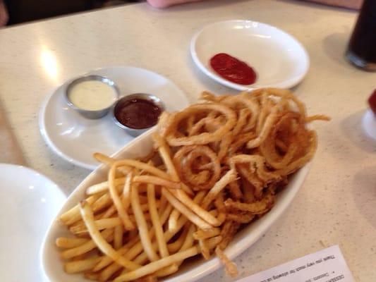 One of the fifty - fifty appetizers, strings and fries.