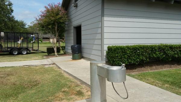 Drinking fountain in front of restrooms