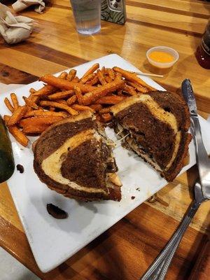 Patty melt with chicken, and sweet potato fries.