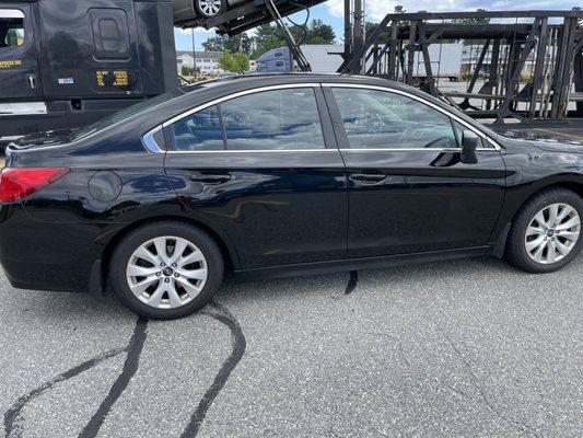 Clean vehicle during pickup with carrier in background.