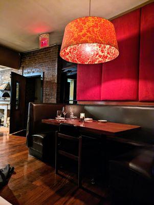 Inside. Dining room. Wide U-shaped booth seating along the perimeter of the main dining room.