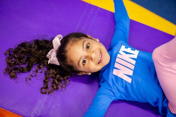 This tyke is all smiles at her summer camp!