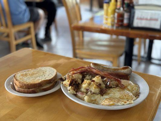 Big John Breakfast with sourdough toast, bratwurst sausage and bacon