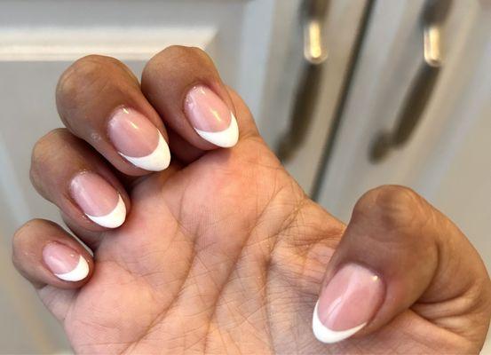 Nails having different size of frenchies.