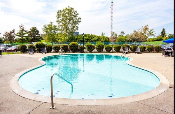 Our pool may be outside, but being tucked in the back of the building behind a tree lined fence gives our swimmers lots of privacy!