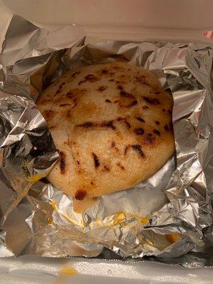 Pupusa with cheese and pork.