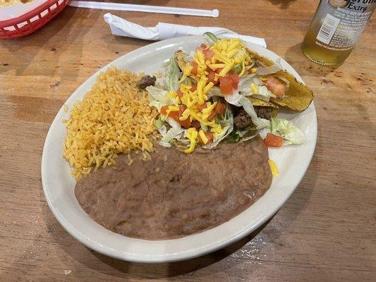 Two taco dinner. One beef, one chicken.  Also comes with beans and rice.