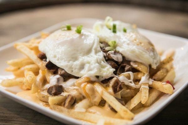 Pork poutine fries. Could NOT finish it. Comes with TWO eggs!