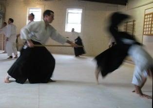 Aaron Cass Sensei throwing with the jo (staff)