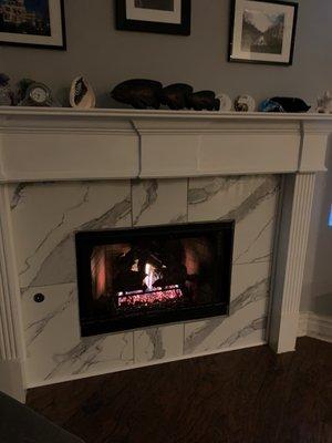 NEW fireplace logs, glass beads & remote!  Working much better now.   We also updated the tile!  We are very happy and warm!