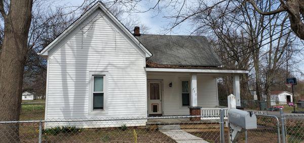 BEFORE picture of this tired cottage.