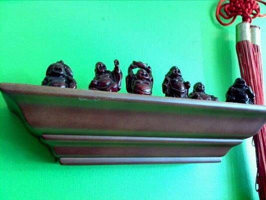 Fat little Buddhas on the wall.