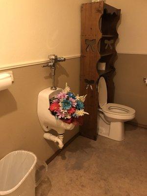 Now that's an awesome way to add a woman's touch to the lady's room.