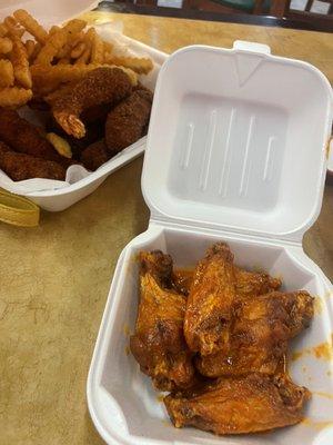 Shrimp and wing combo. This sauce was the 24k sauce. Tangy spicy. I liked it!  Shrimp is huge and a good bread to shrimp ratio.