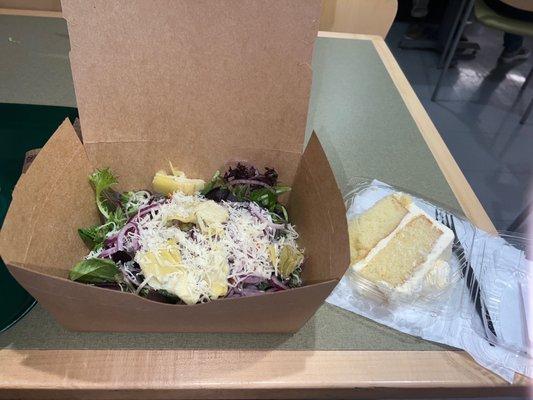 A girl's lunch: salad...and cake.