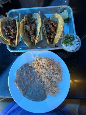 Steak street tacos with lime onion cilantro, beans rice ! Ohhh so good , on lunch menu $9.99 includes  a drink .