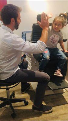 Dr. Stybel giving a great HI-5 to my daughter during the eye evaluation after using the eye mask hero to check her eyes