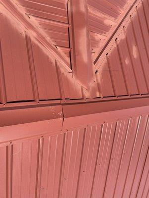 The spray painted a new roof with red paint to hide the scratches they done