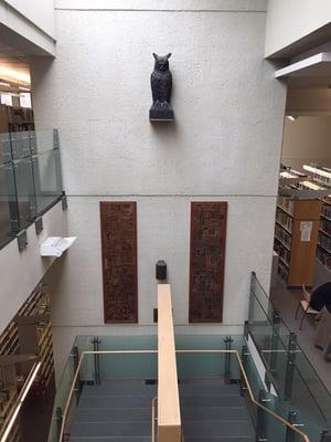 Copper panels from the original library doors repurposed as hanging art. Design by Leslie Segal. #library #typeface