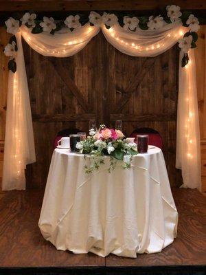 Skylight room- sweetheart table with our Barn door backdrop.