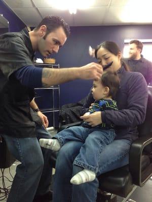 Nick giving our son his first haircut. Great job!