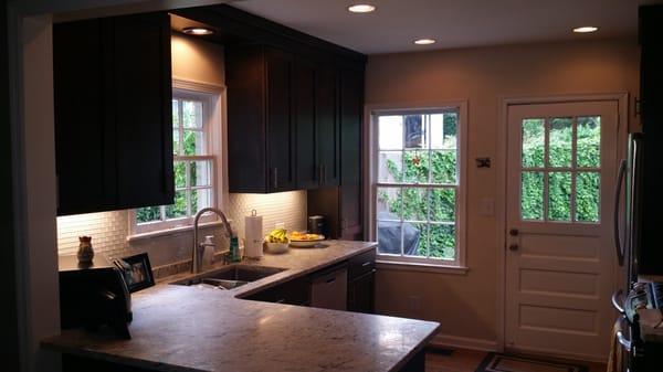 Winnona Park Kitchen, custom dark walnut cabinets, white/grey granite countertops, glass mini-subway tile backsplash, accent lighting