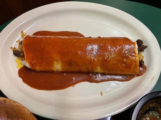 Carne Asada burrito with house red sauce.