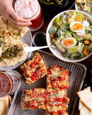 Detroit-style pizza, Caesar Salad + Hummus with fresh beer