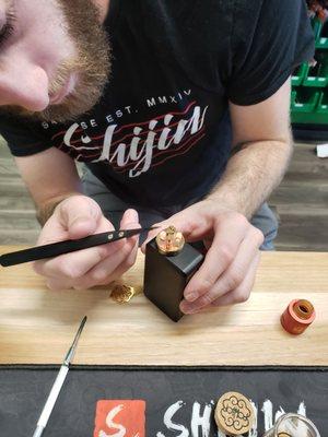 Brushing dual coils to fire evenly