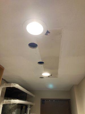 Two recessed lights in laundry room