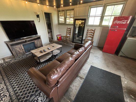 Our Groom's Den, complete with flatscreen, full-length mirrors and antique Coca-Cola fridge. See rest of gallery for the bar.