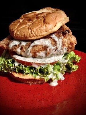 Clucking good fried chicken sandwich on brioche, with lettuce, tomato, drizzled with AnnV house-made dill sauce