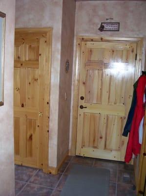 Steel fire rated door painted to match 6-panel pine doors