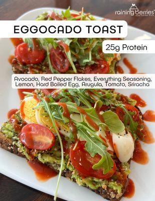 Eggocado Toast!  2 slices of multigrain toast topped with creamy avocado, zesty lemon, 2 hard-boiled eggs, arugula, tomato, red pepper flake