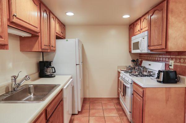 Deluxe Kitchen with Oak Cabinetry and Above-Range Microwave