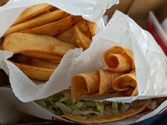 French fries, taquitos, and chicken taco