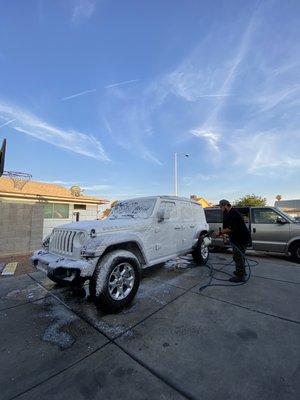 Mr. H washing my Jeep Wrangler