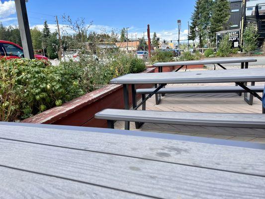 Trex decking material tables.. very hot in the summer.