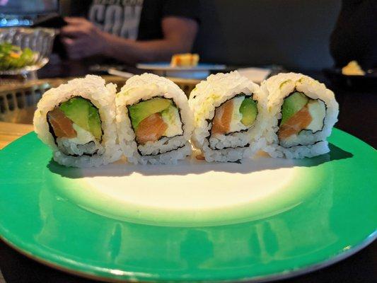 Salmon, avocado, and cream cheese sushi roll.