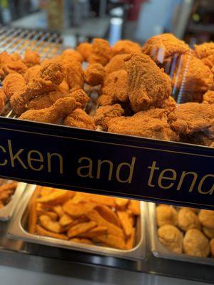 Chicken, potato wedges and biscuits.